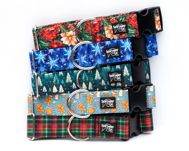 Set of colorful dog collars with floral, Christmas-themed, and plaid patterns on a white background.