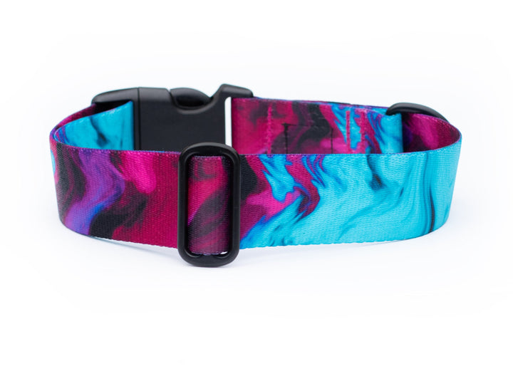 Dog collar with a colorful pink and blue pattern on a white background