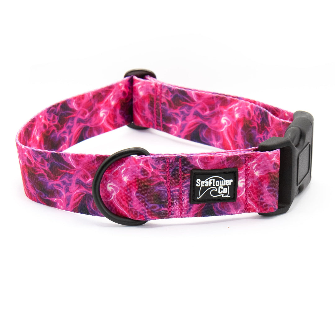 Pink and purple patterned dog collar with a brand label on a white background