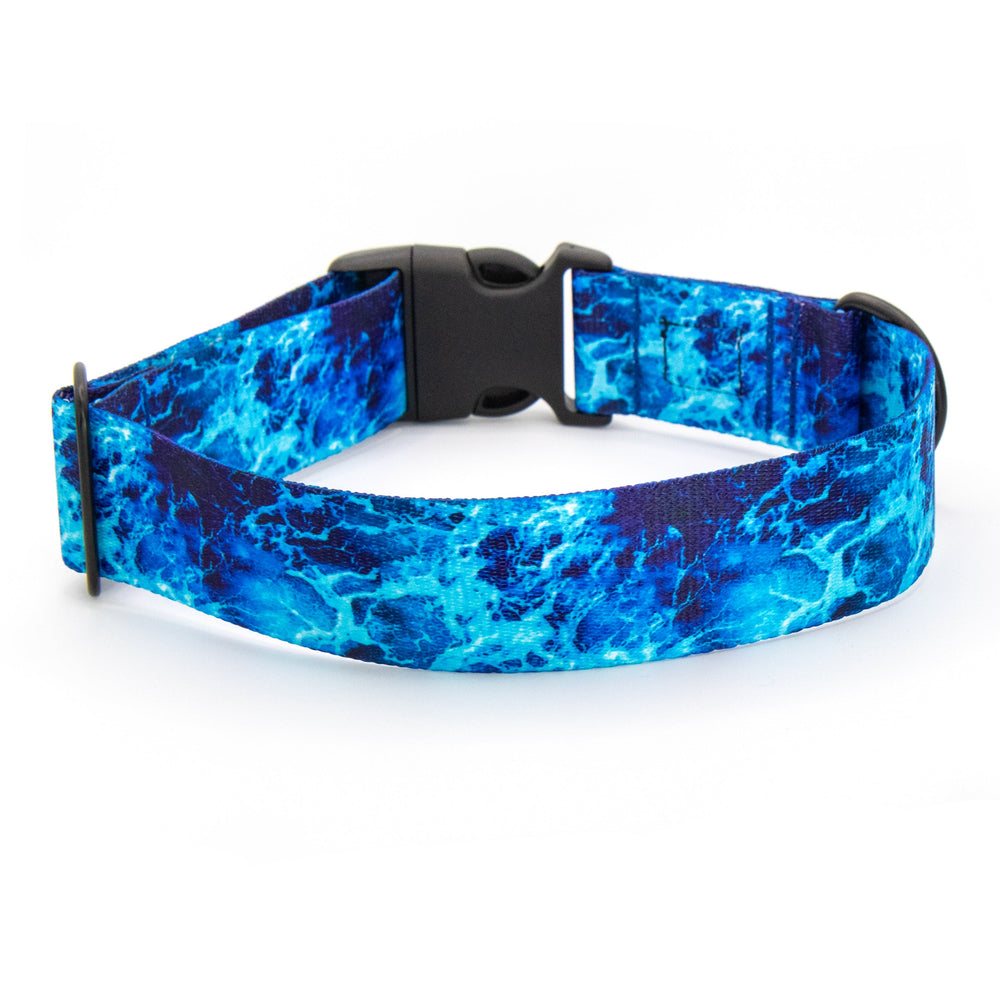 Blue marbled patterned dog collar with a visible brand logo on a white background
