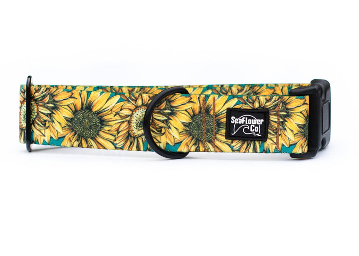 Sunflower-patterned dog collar with a visible brand logo on a white background