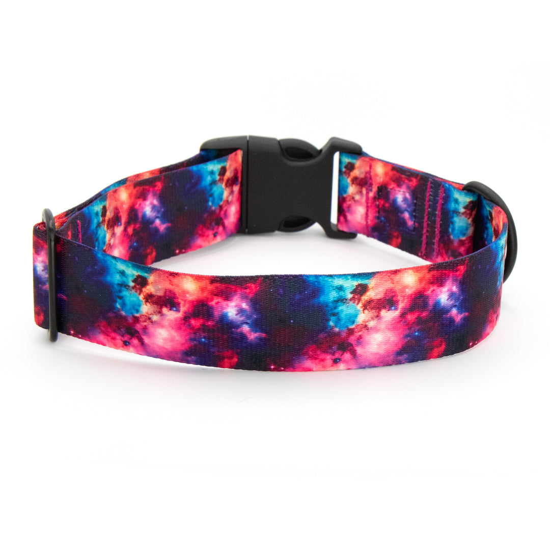 Colorful galaxy-patterned dog collar on a white background