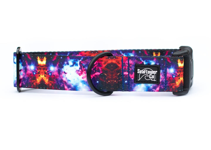 Colorful galaxy-patterned dog collar with a brand logo on a white background