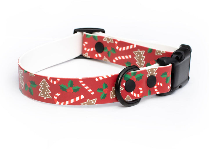 Red dog collar with Christmas-themed pattern on a white background