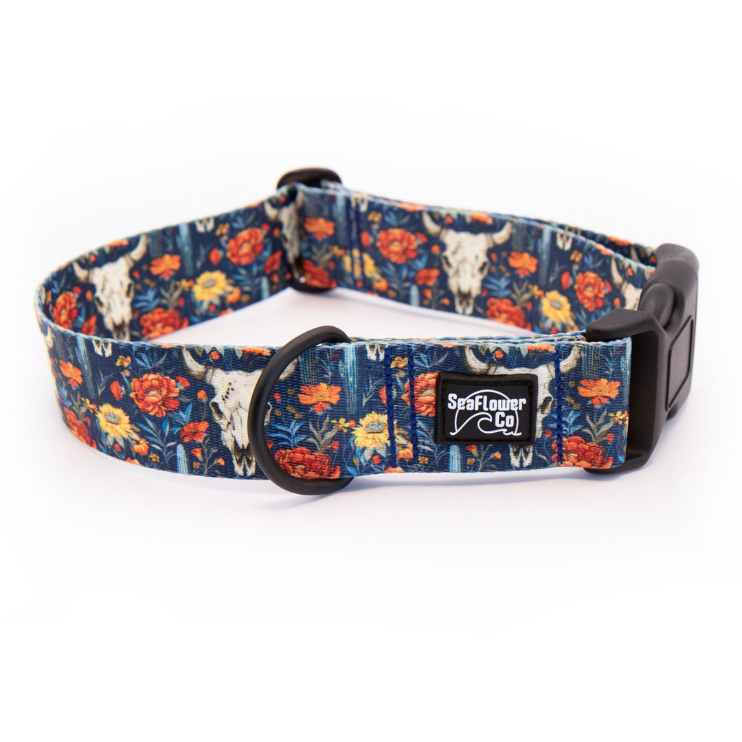 Dog collar with floral and steer skull pattern on a white background
