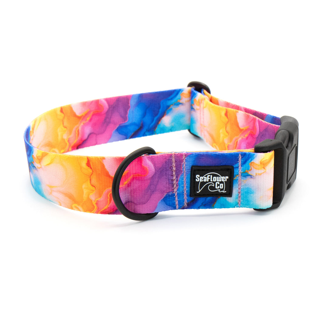 Colorful tie-dye dog collar with a brand label on a white background