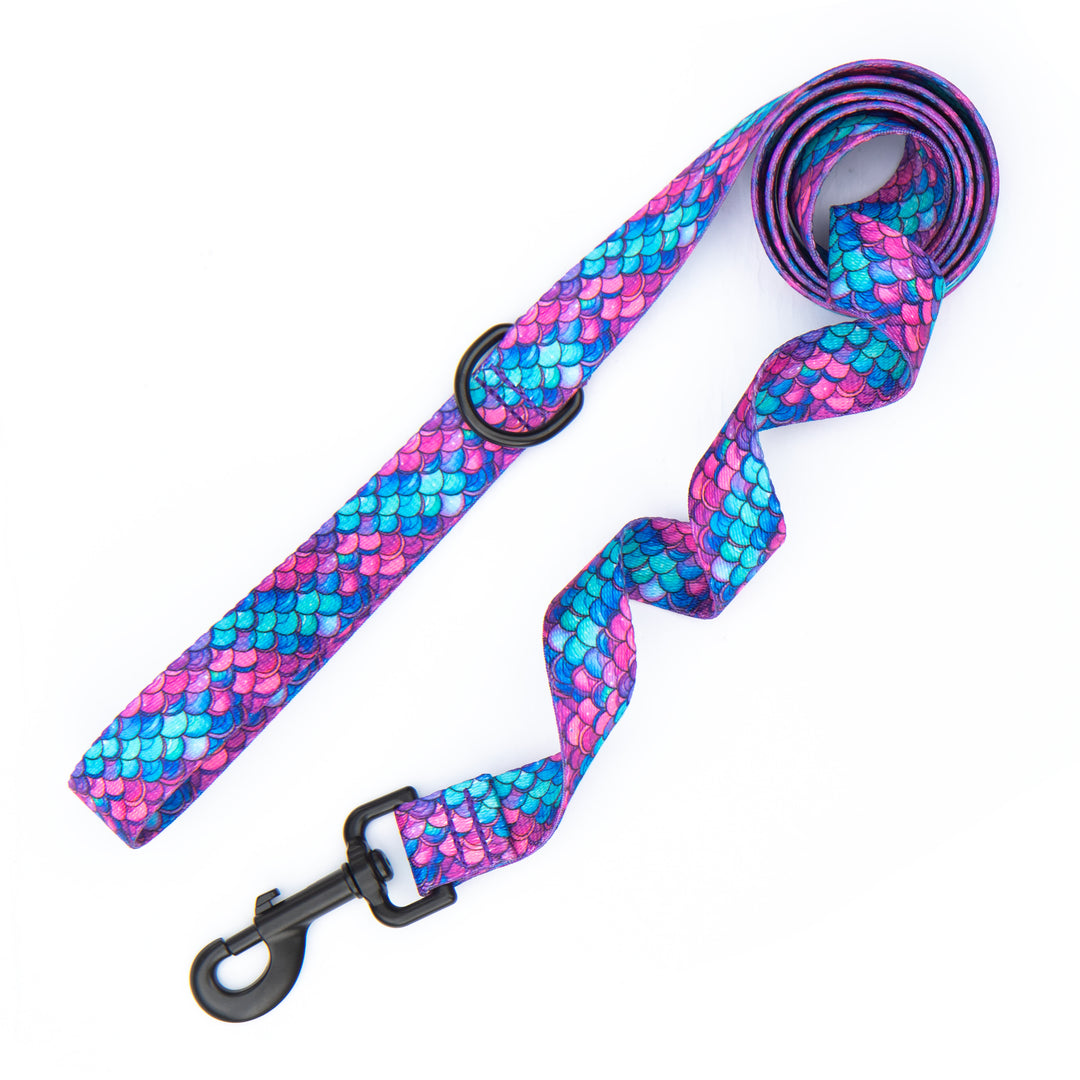 A mermaid scale patterned dog leash with black metal hardware, shown on a plain white background.