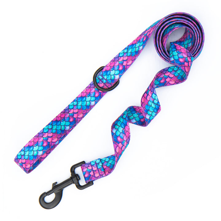A mermaid scale patterned dog leash with black metal hardware, shown on a plain white background.